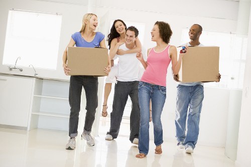 Removal van and moving team in a Highbury residential street