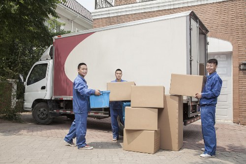 Removal team planning a move in Highbury street with residential buildings nearby