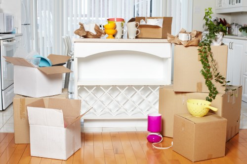Moving team loading boxes and furniture for a Highbury move