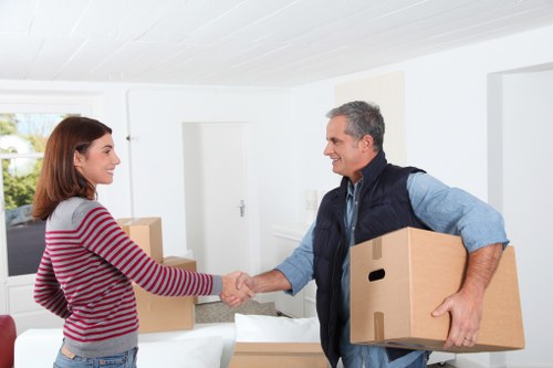 Local moving van handling furniture and boxes in Highbury