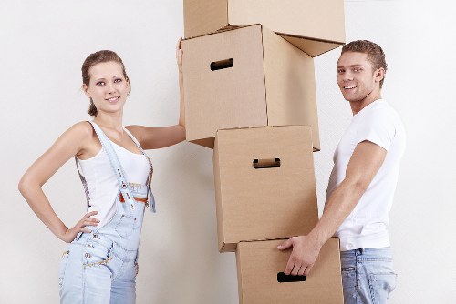 Packed furniture and boxes being transported on a removal van