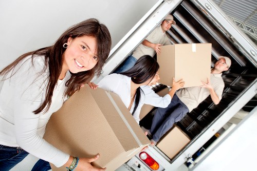Careful loading of household items for a local removal service